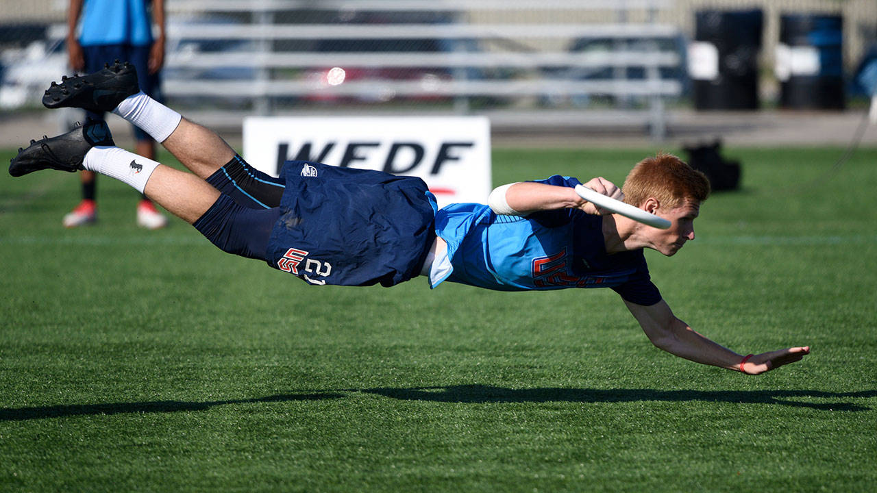 Conner Ryan dives for the disc at the World Junior Ultimate Championships held in Canada. Photo by Ulti Photos.