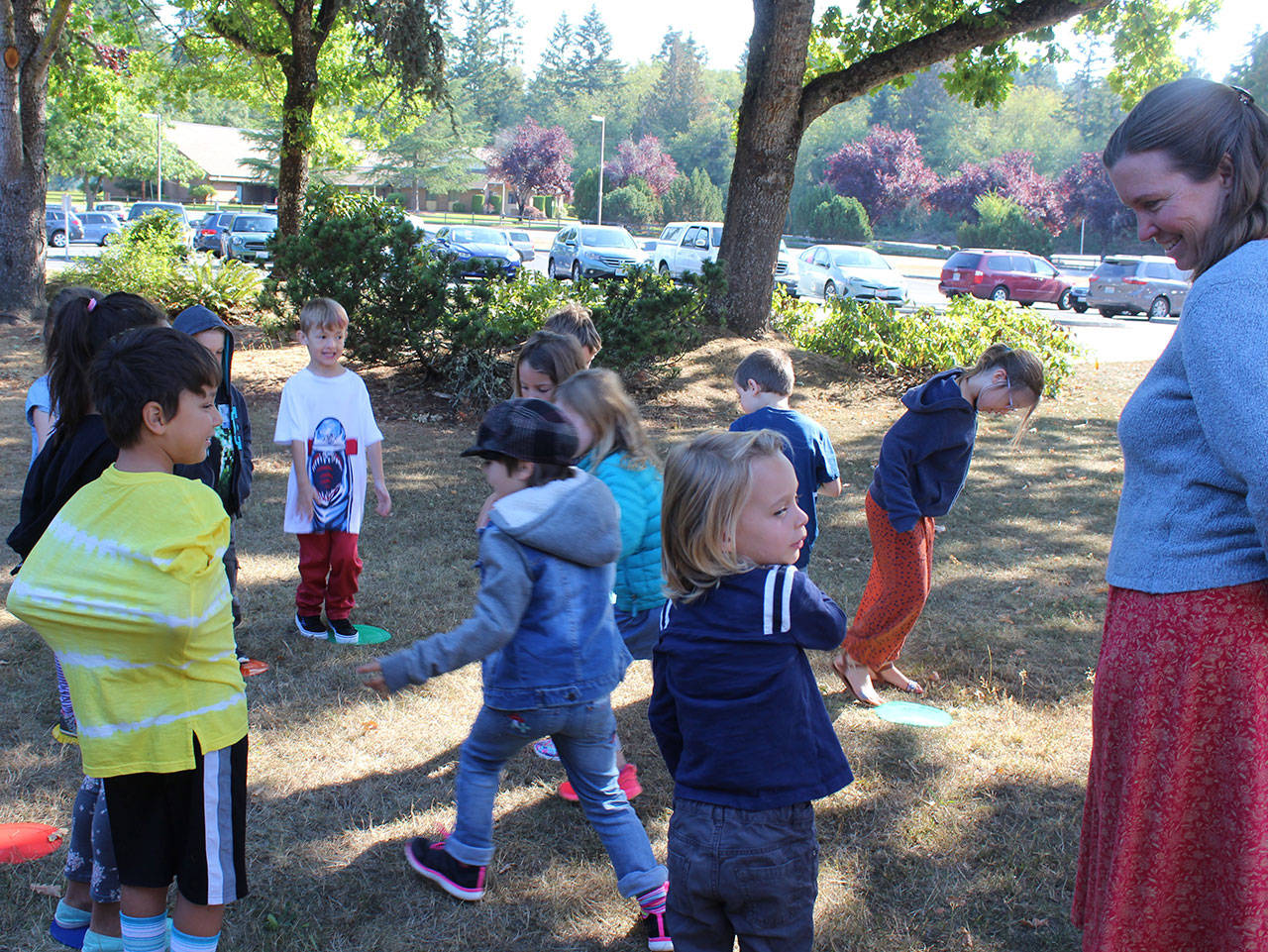On the first day of school Tuesday, Sarah Gillette took her South Whidbey Academy class outside for a learning skills game. Some 1,300 students reported to four district schools as scheduled when a teachers strike was averted with a last-minute deal. (Photo by Patricia Guthrie/Whidbey News Group)