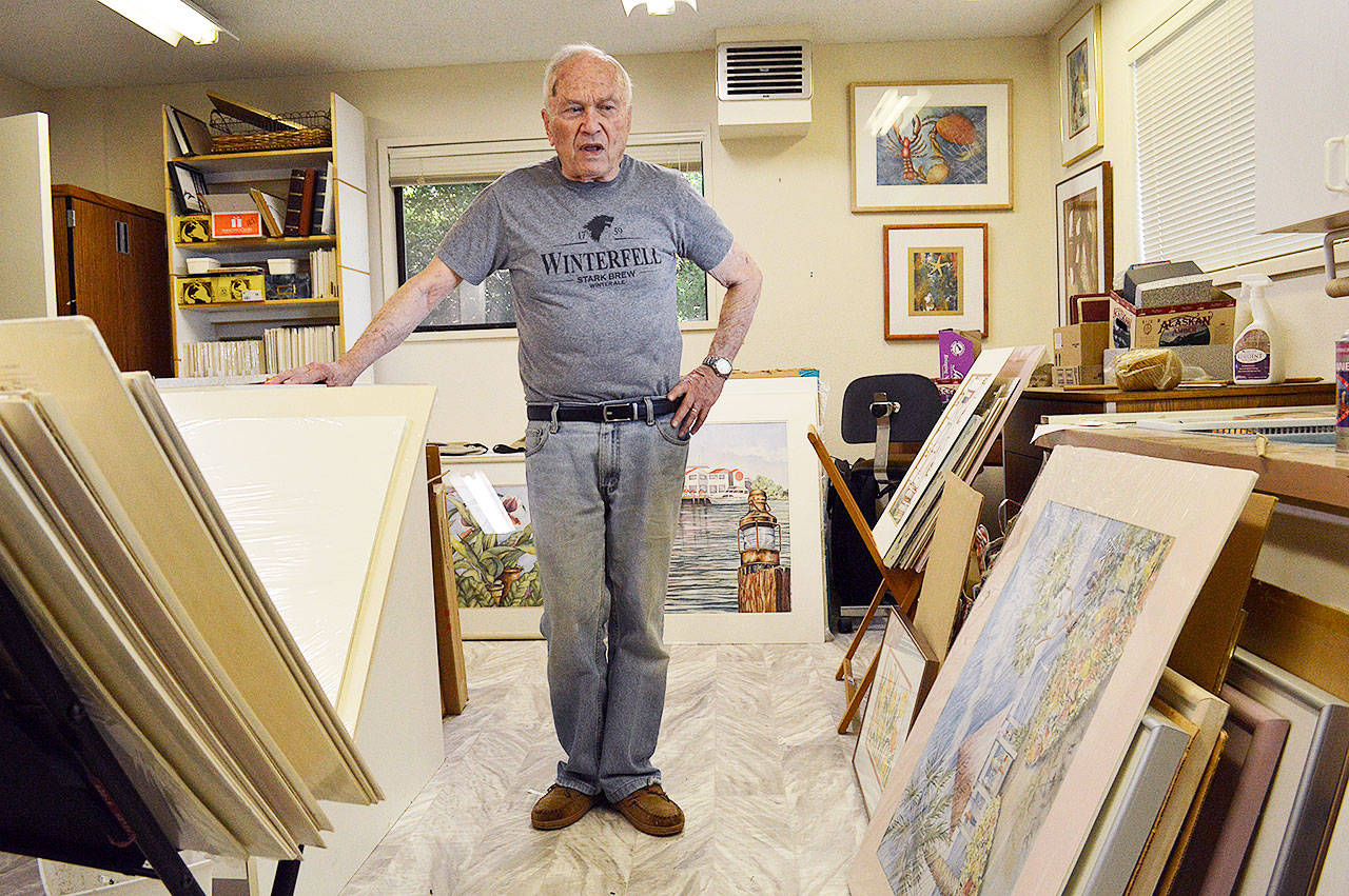 Charley Ryder stands in his basement, which is full of over 50 years of paintings done by his late wife Helen Ryder. Helen Ryder, a member of Whidbey Allied Artists, died in March and her art will be featured by WAA starting Sept. 21 at the Coupeville Recreation Hall. Photo by Laura Guido/Whidbey News-Times