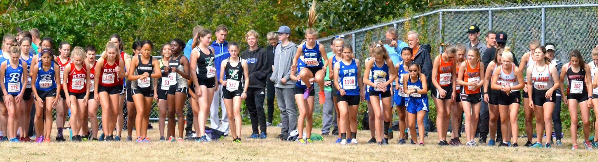 South Whidbey’s Kaia Swegler Richmond is hopping to go at the start of the sophomore girls race Saturday. (Photo by Karen Swegler)