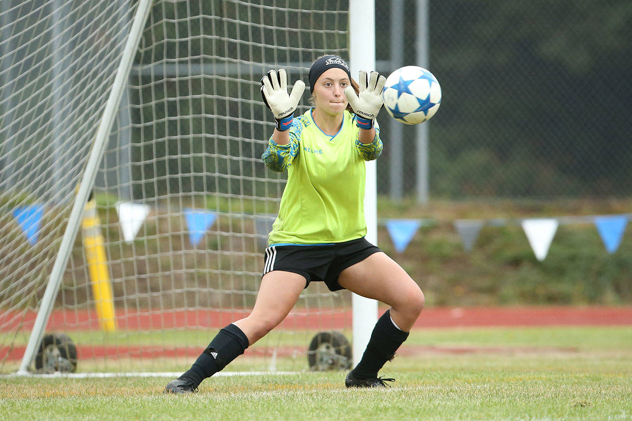 Keeper Nicole Helseth records a save on the way to shutting out Chimacum.(Photo by John Fisken)
