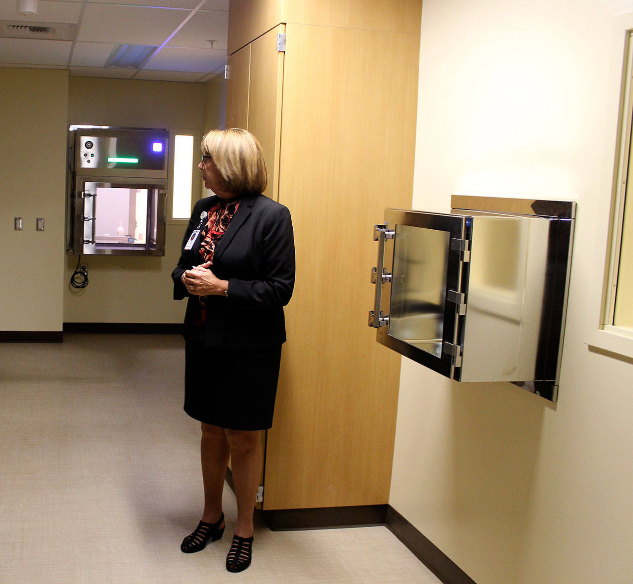 WhidbeyHealth CEO Geri Forbes gives a tour of the new pharmacy opening in November. (Photo by Patricia Guthrie/Whidbey News Group)