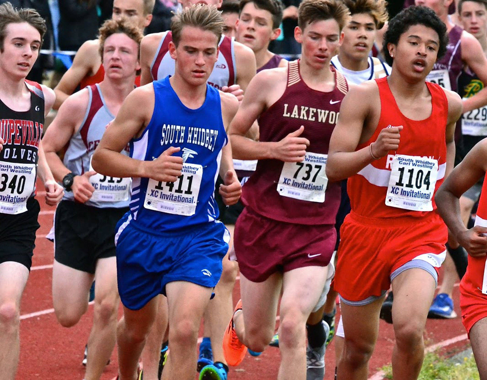 South Whidbey’s Michael Cepowski (1411) runs with the pack during Saturday’s meet. (Photo by Karen Swegler)