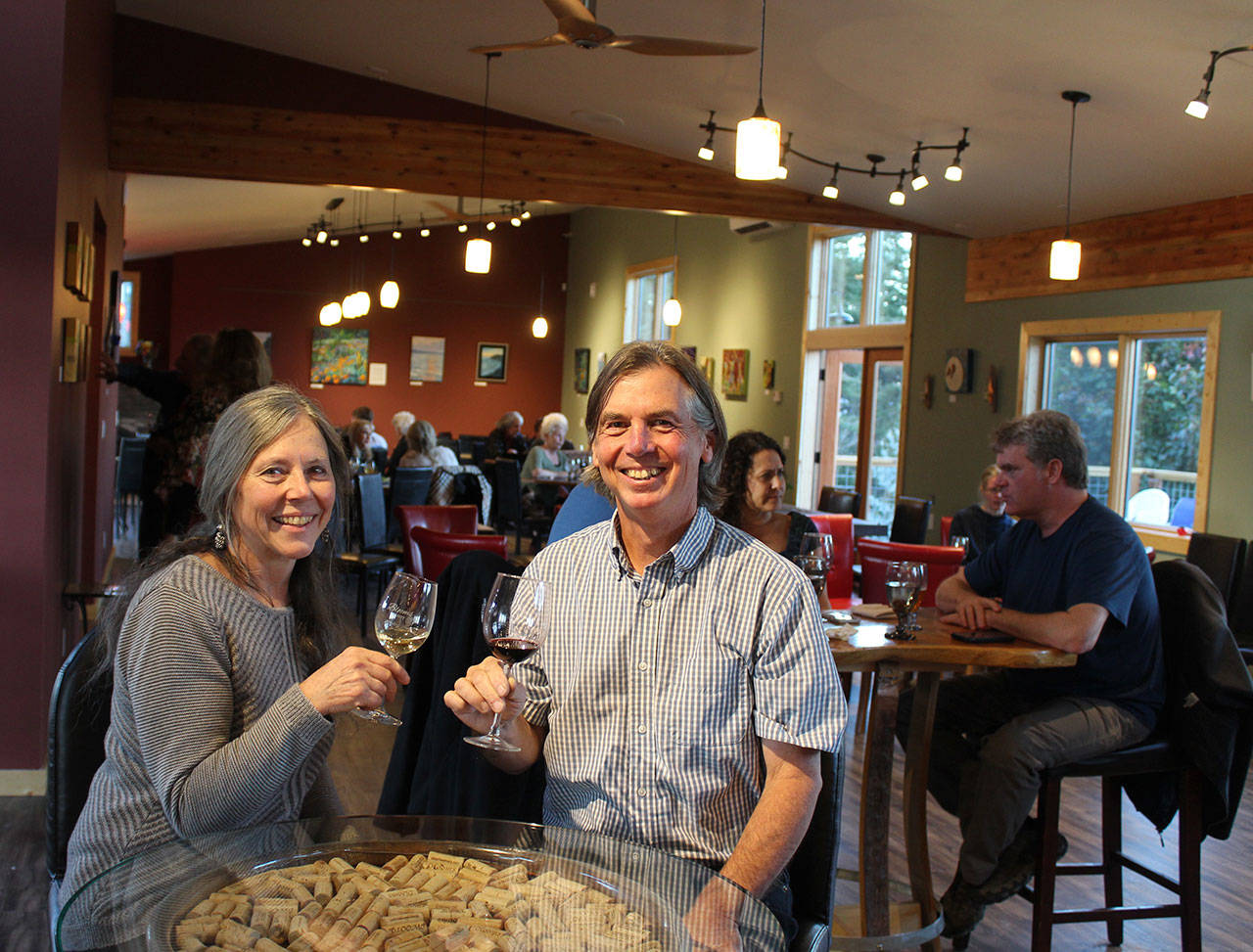 Virginia and Ken Bloom toast the opening of their new Freeland winery and bistro.
