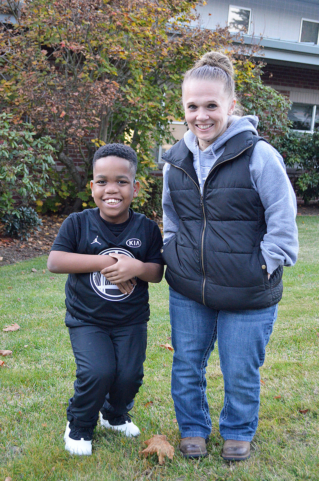 KD Carpenter and Lolly Titherington stand outside the Oak Harbor Fire Station, where Titherington works. They are part of an organization that helped declare October as Dwarfism Awareness and Acceptance month in Washington state. Photo by Laura Guido/Whidbey News-Times