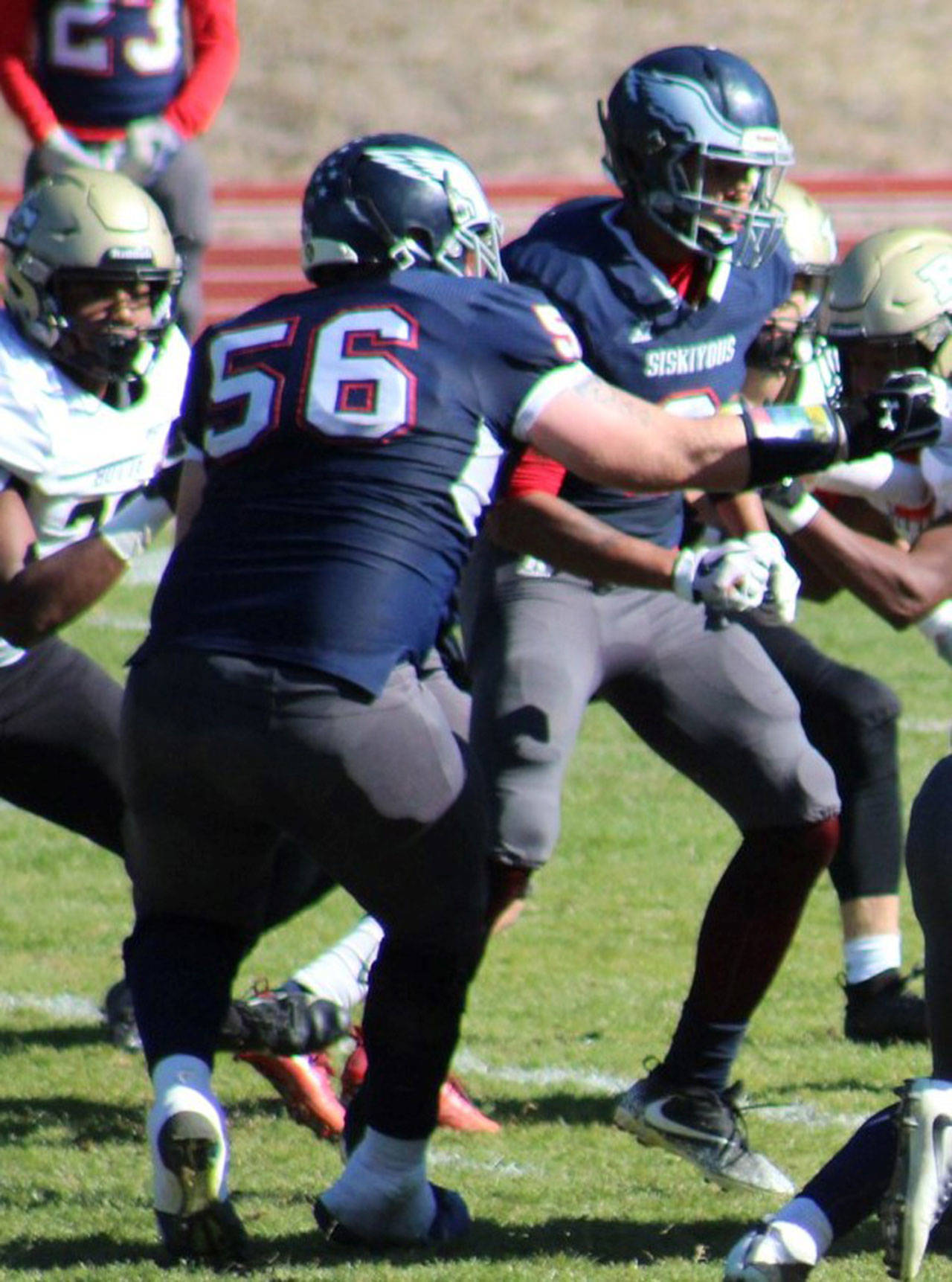 Chase Barthlett (56) blocks during a football game this fall. (Photo courtesy of College of the Siskiyous Athletics)