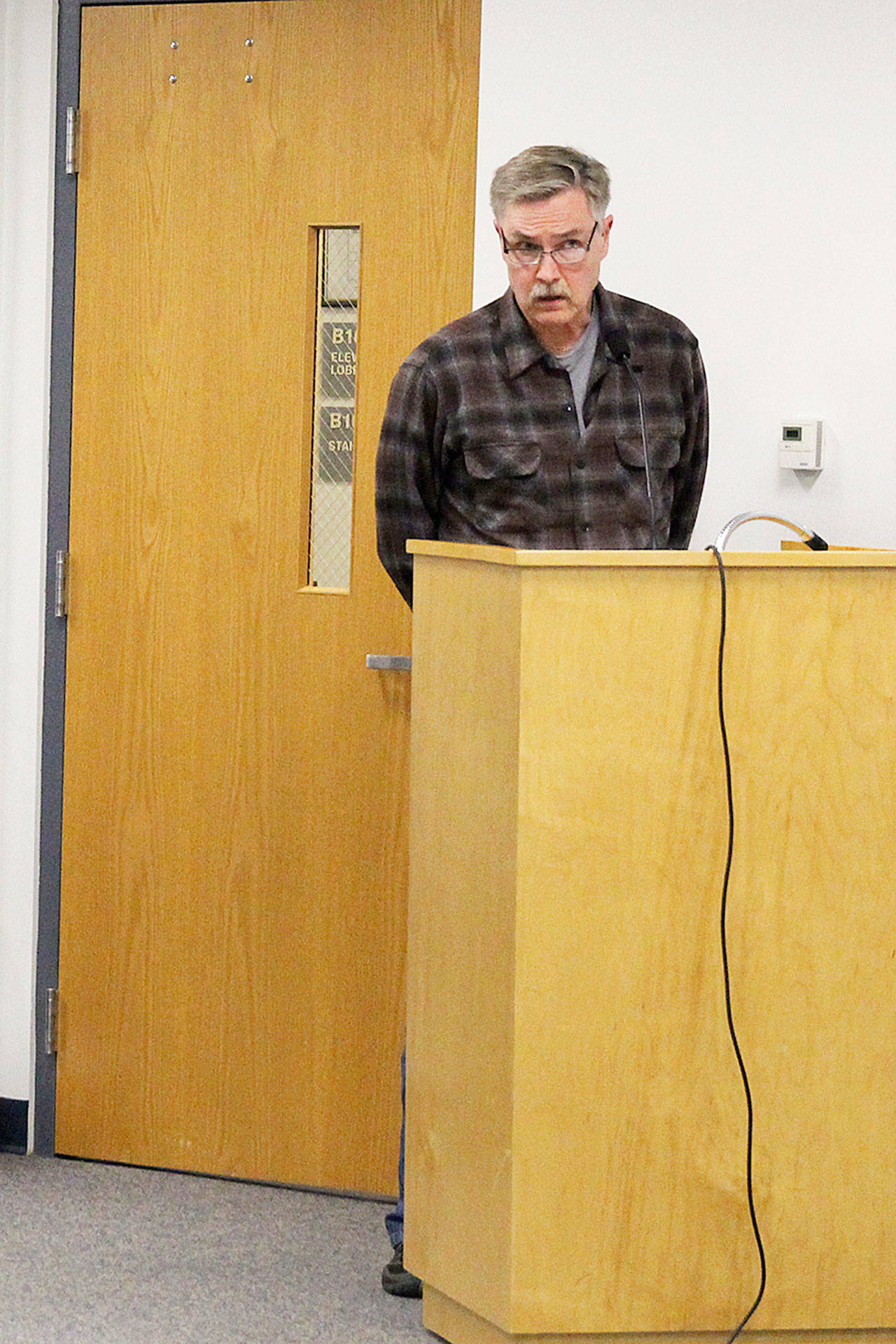 Paal Cammermayer asks the planning commission to propose allowing rural event centers on land zoned rural forest at a event code public hearing Monday night. Photo by Laura Guido/Whidbey News Group