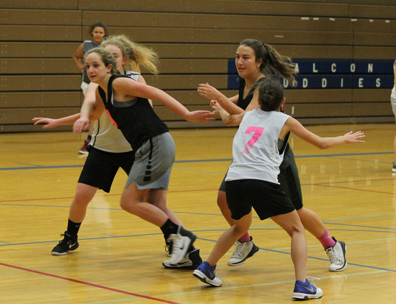 Ashley Lynch, left, and Farriss Jokinen try to get open against a full court press in practice last week. (Photo by Jim Waller/South Whidbey Record)