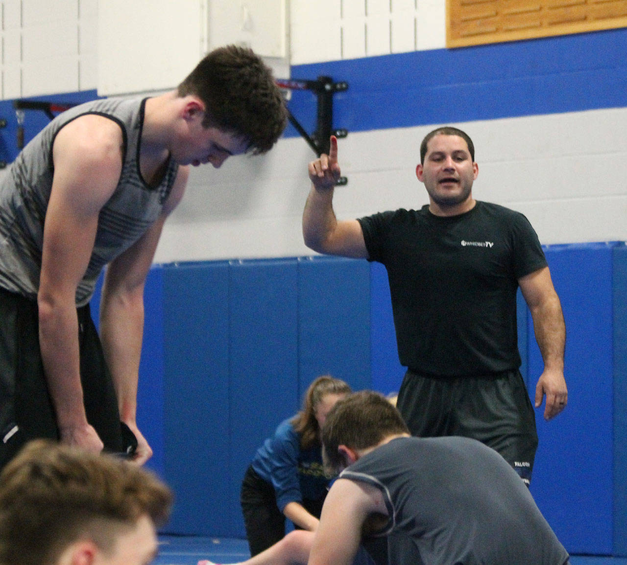 Coach Robbie Bozin instructs his team during practice earlier this season. (Photo by Jim Waller/South Whidbey Record)