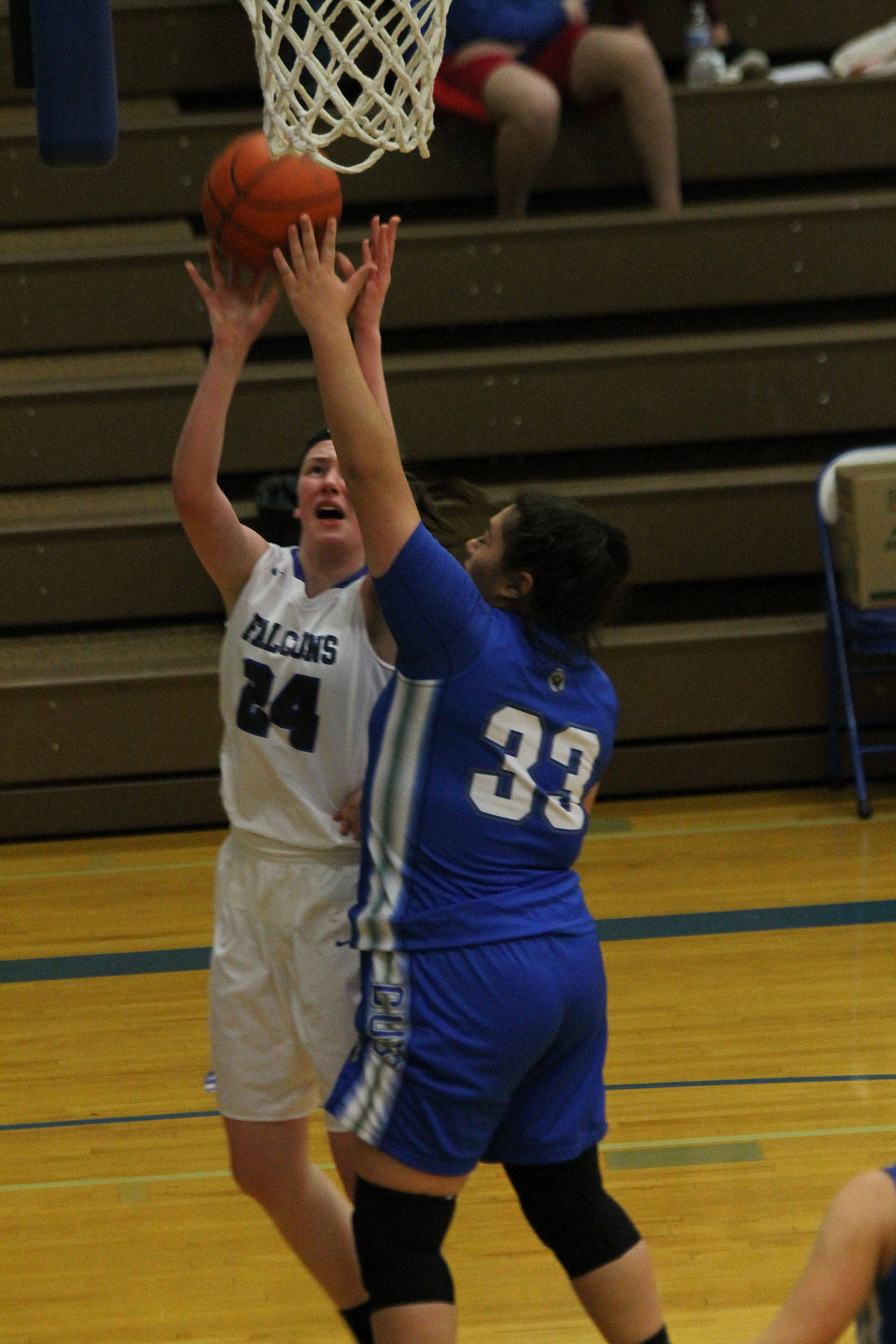 Ella Wood (24) takes the ball to the hoop for South Whidbey.(Photo by Jim Waller/South Whidbey Record)