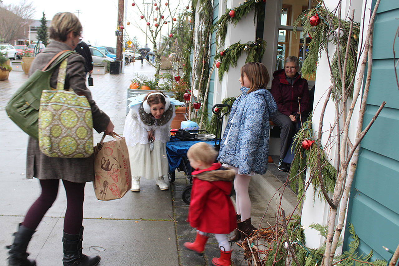 Magic Fairy Hahna Luna entertains visitors on a recent Sunday as part of Langleys whalecome to its Clipper ship passengers. (Photo by Patricia Guthrie/Whidbey News Group)
