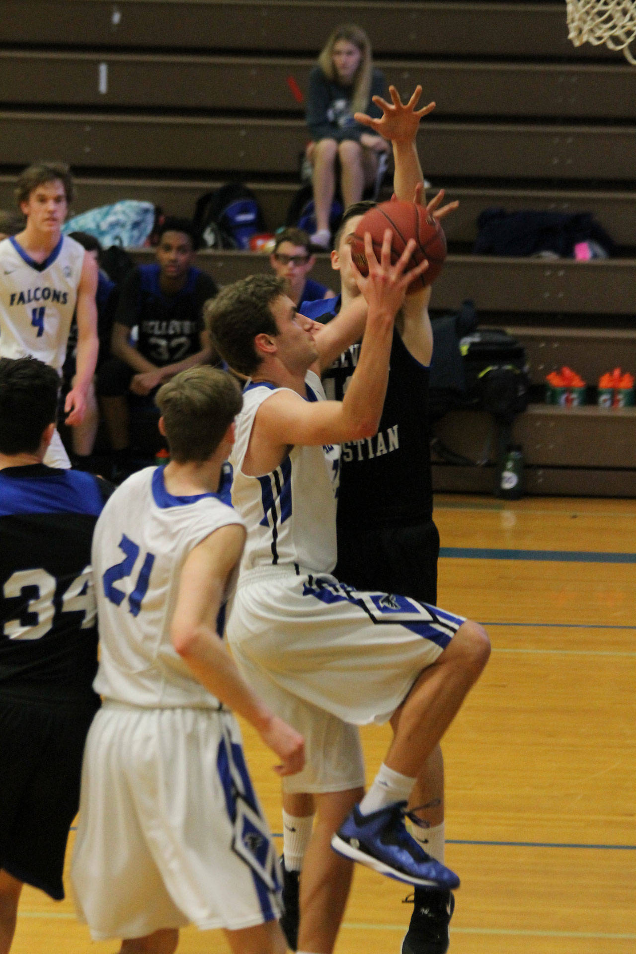 Levi Buck takes the ball to the hole in Saturdays win over Bellevue Christian. (Photo by Jim Waller/South Whidbey Record)