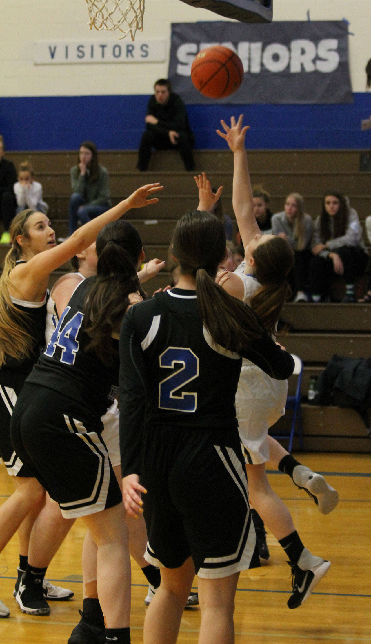 Kayla Knauer shoots a reverse lay-in against Bellevue Christian.(Photo by Jim Waller/South Whidbey Record)