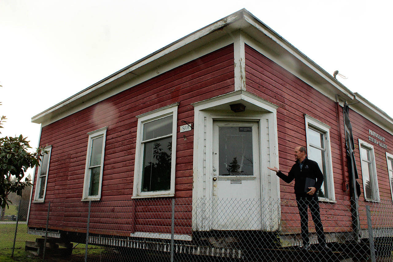 Whidbey Telecom’s George Henny in front of South Whidbey’s original telephone building built in 1913. The company plans to move the structure to downtown Langley and renovate it into a museum of telecommunications history. (Photo by Patricia Guthrie/Whidbey News Group)