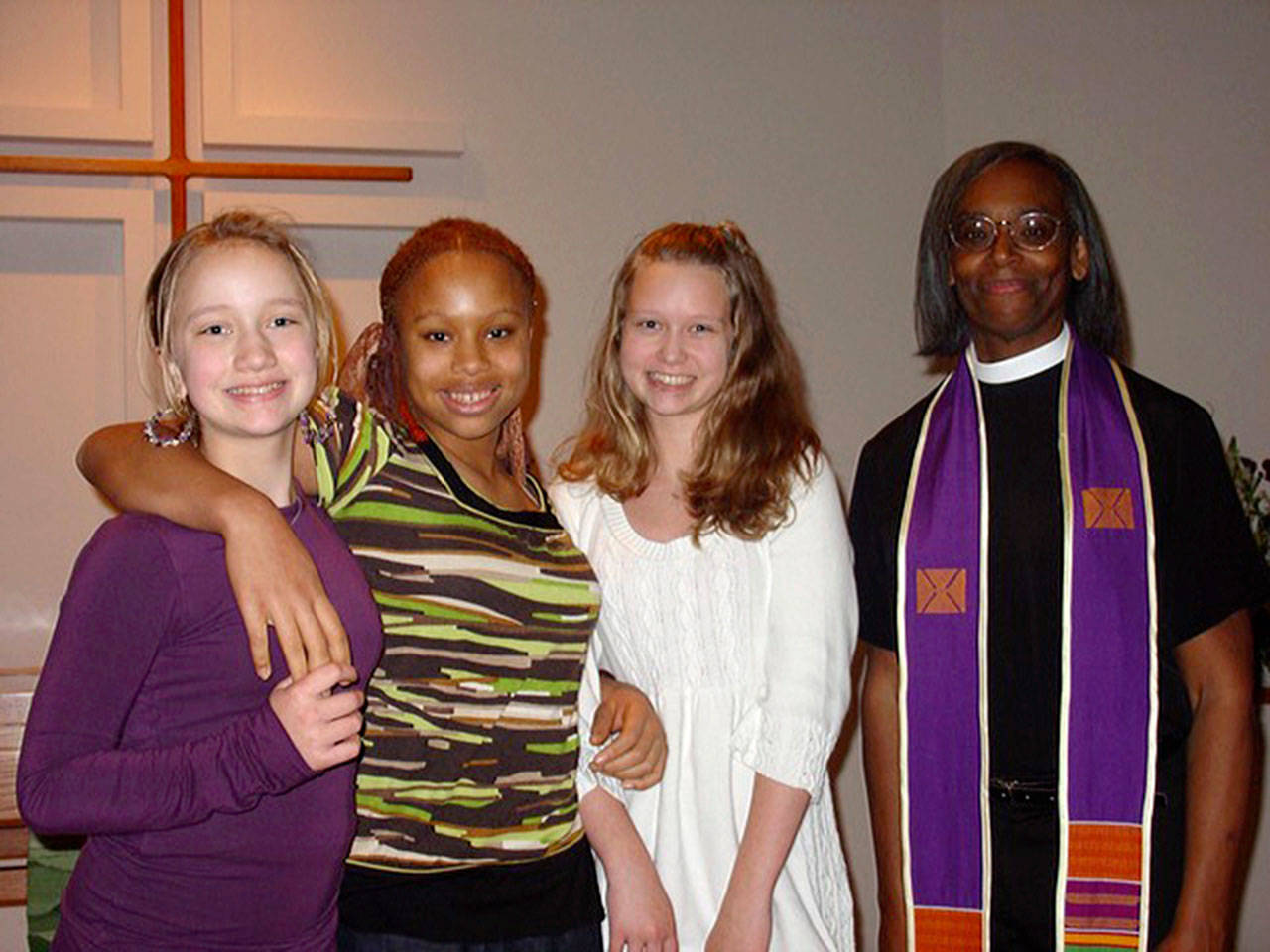 Attending a previous Martin Luther King Jr. “Blessed are the Peacemakers” event is Haley McConnaughey (left), Melissa Smith, Hannah McConnaughey and the Rev. Carla Robinson, who will be speaking Sunday at St. Augustine’s Episcopal Peace Fellowship event. (Photo provided)