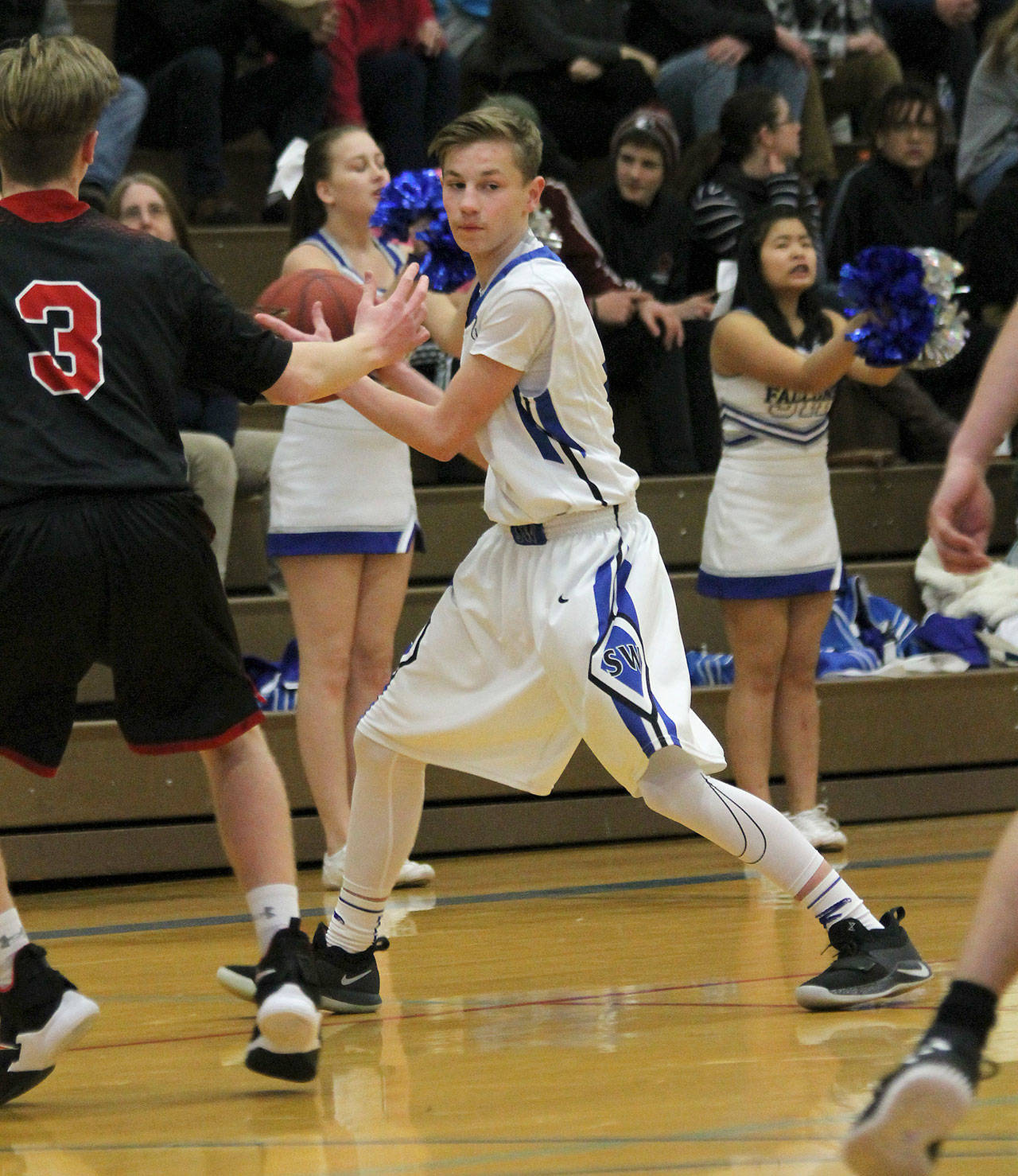 Senior Brock Gray looks for an open teammate.(Photo by Jim Waller/ South Whidbey Record)