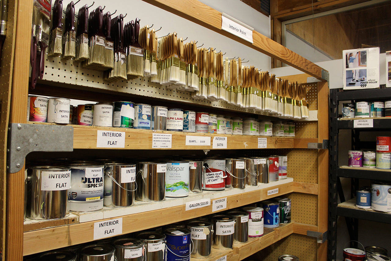 New paint brushes top the row of neatly stacked paint at the Freeland Habitat for Humanity store. Gallons costs $10, quarts $4 and brushes cost $2.50-$4. (Photo by Patricia Guthrie/Whidbey News Group)