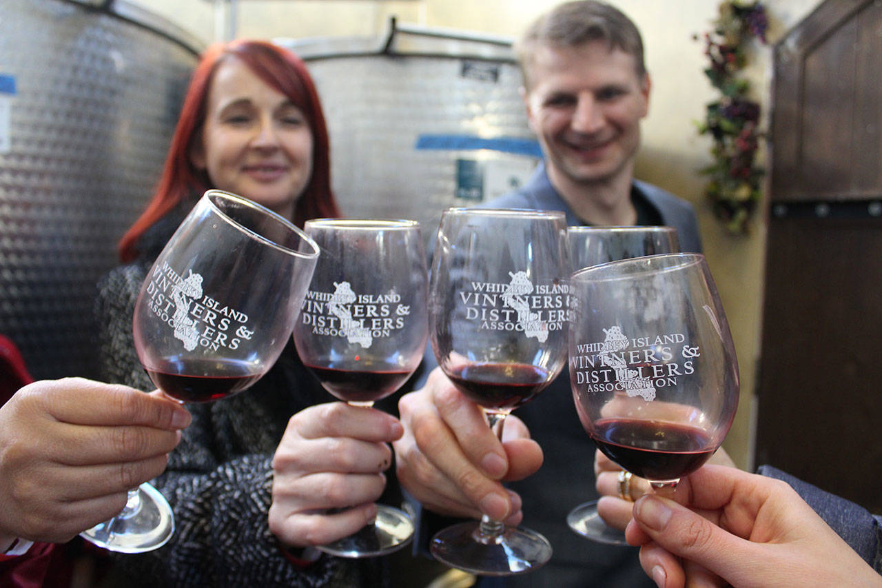 A group of friends toast during last year’s Red Wine and Chocolate Tour that’s sponsored by Whidbey Island Vintners and Distillers Association. (Photo by Patricia Guthrie/Whidbey News Group)
