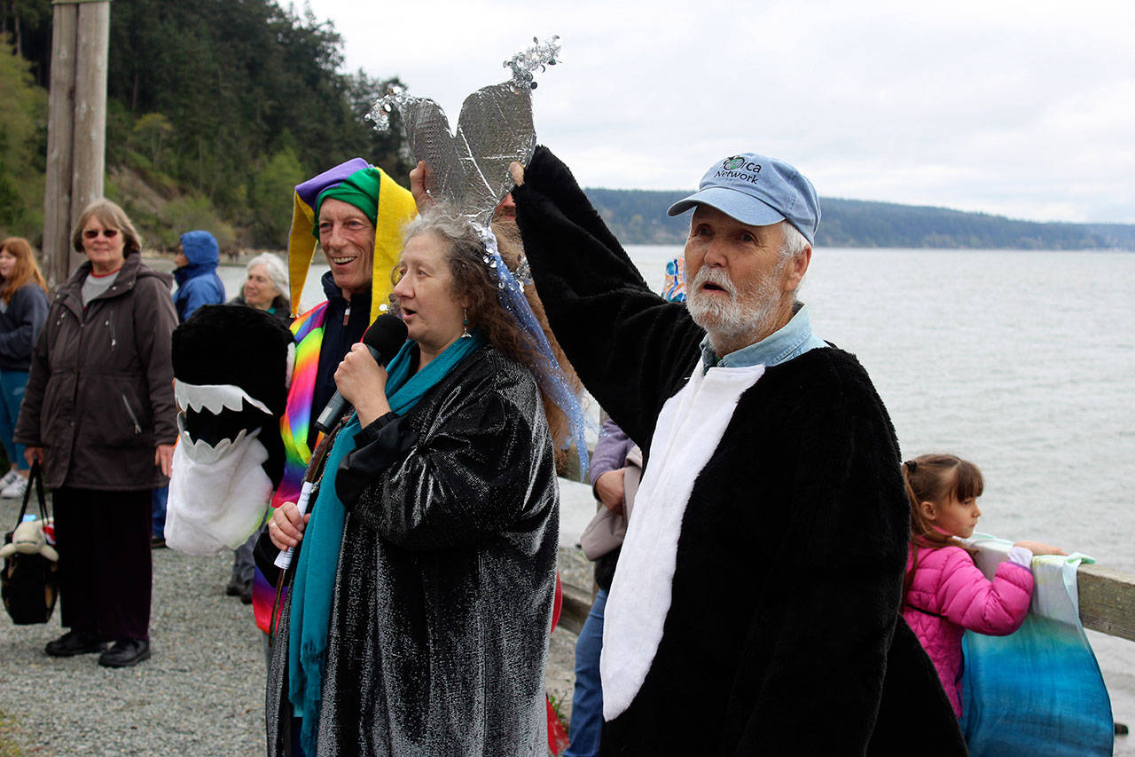 Whale activist Howard Garrett dresses as an orca every year at Langley’s annual Welcome the Whales parade. Standing next to him is Susan Berta, wearing silver whale flukes on her head. The married couple co-founded Orca Network. (Photo by Patricia Guthrie/Whidbey News Group)