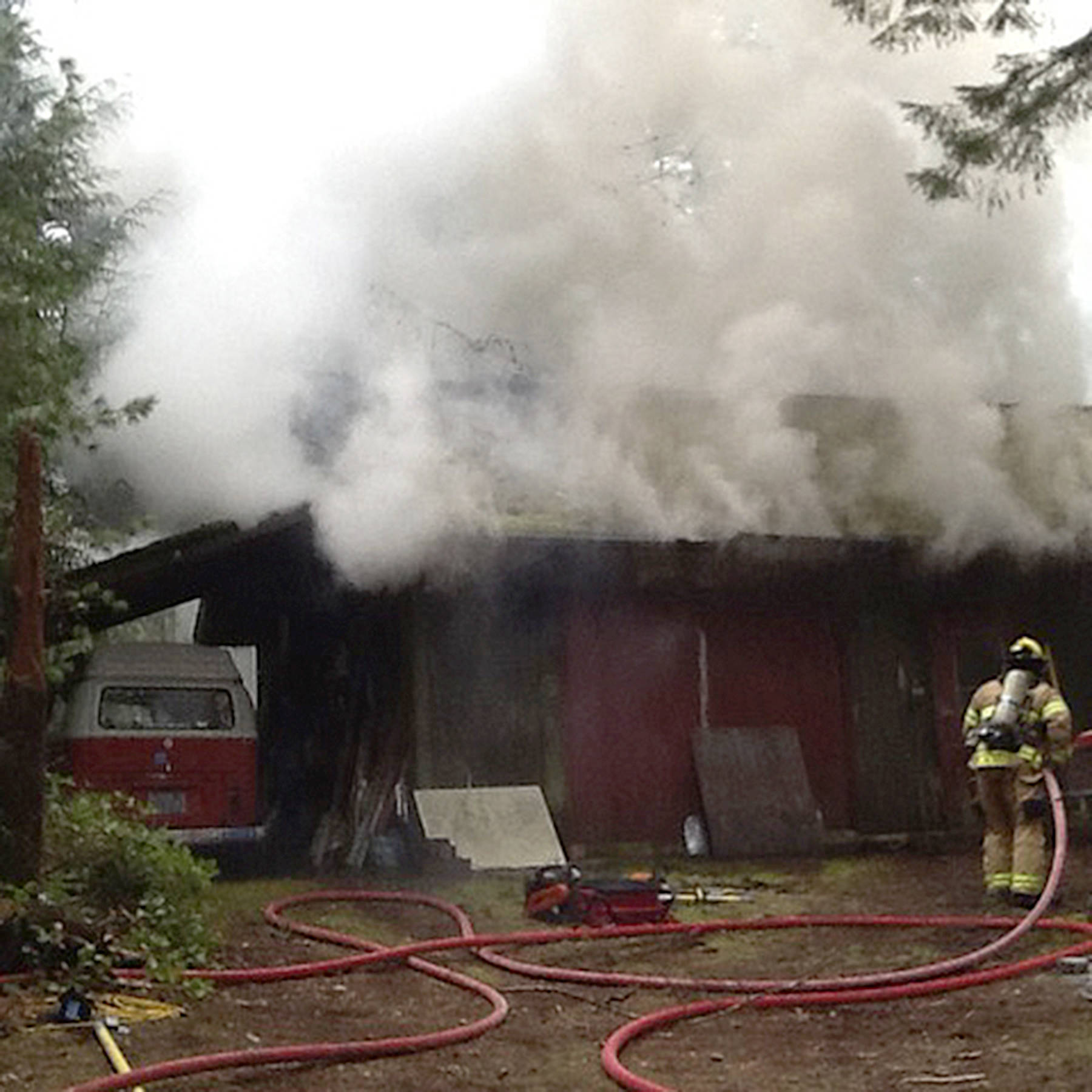 South Whidbey Fire/EMS crews faced heavy smoke Wednesday attacking a fire that broke out in a classroom science laboratory behind a rural Langley home. No injuries were reported.(Photo provided)