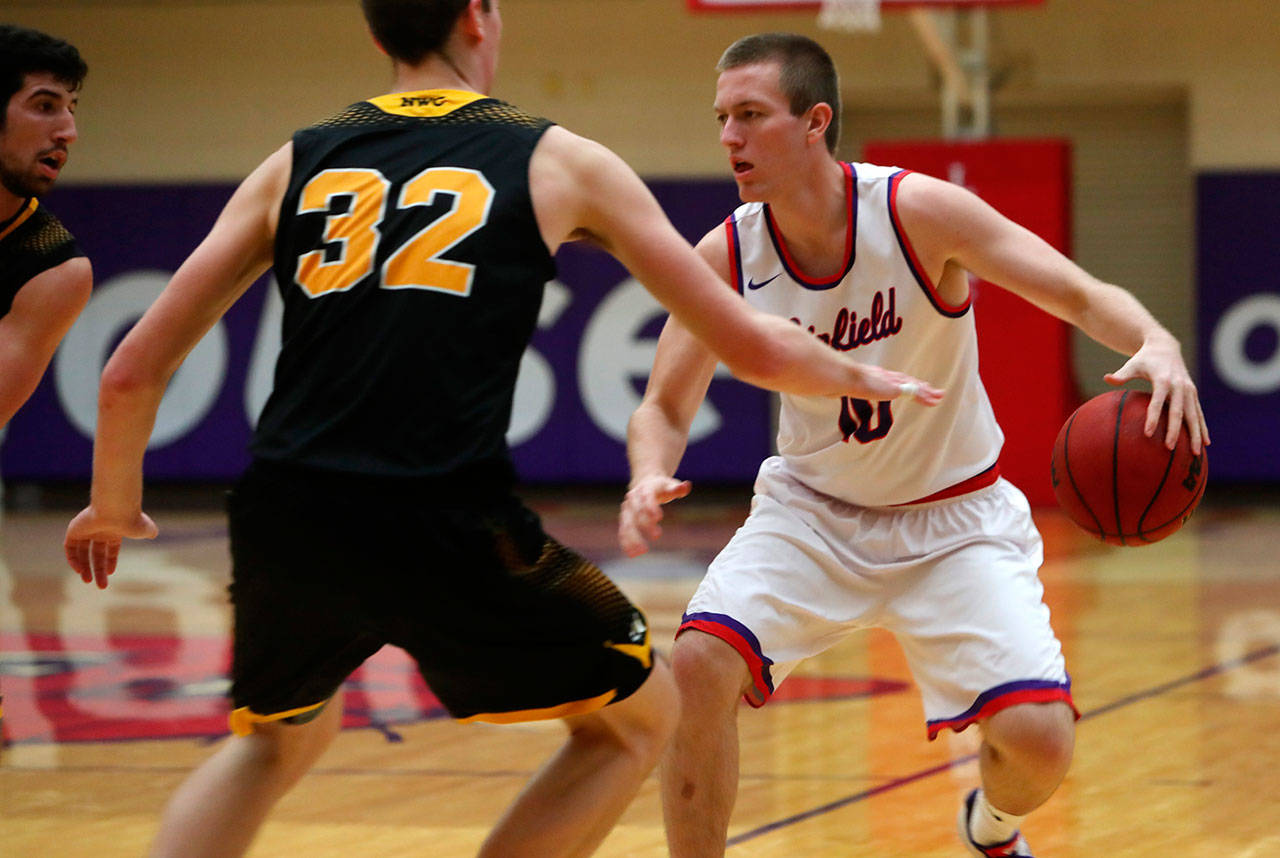 South Whidbeys Parker Collins, right, sets up the offense for Linfield College in a game this season. (Photo courtesy of Linfield College)
