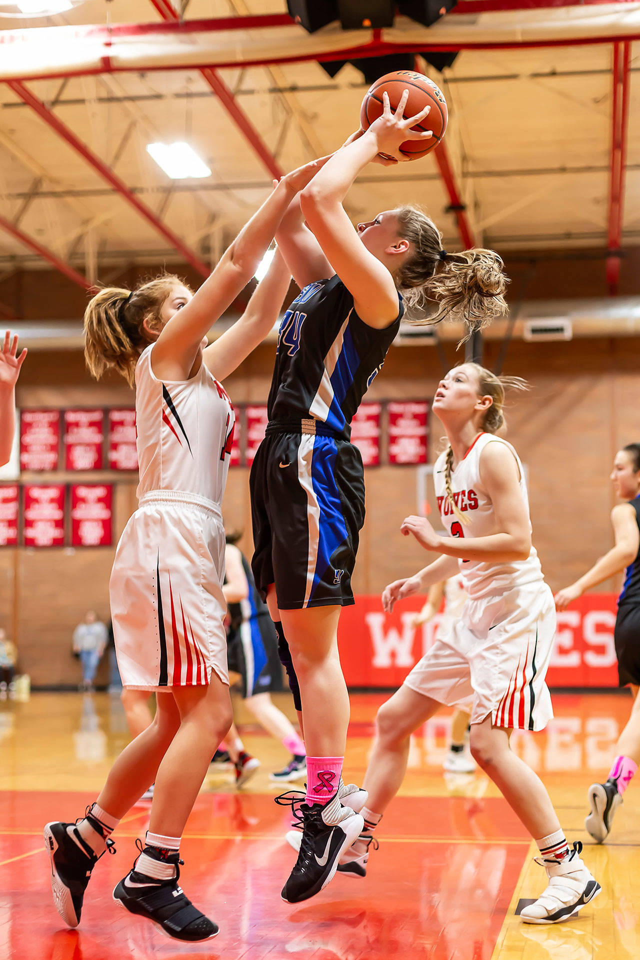 Emma Hodson puts up a jump shot against Coupeville this season. The sophomore was named to the league honorable mention list for her play this winter. (Photo by John Fisken)