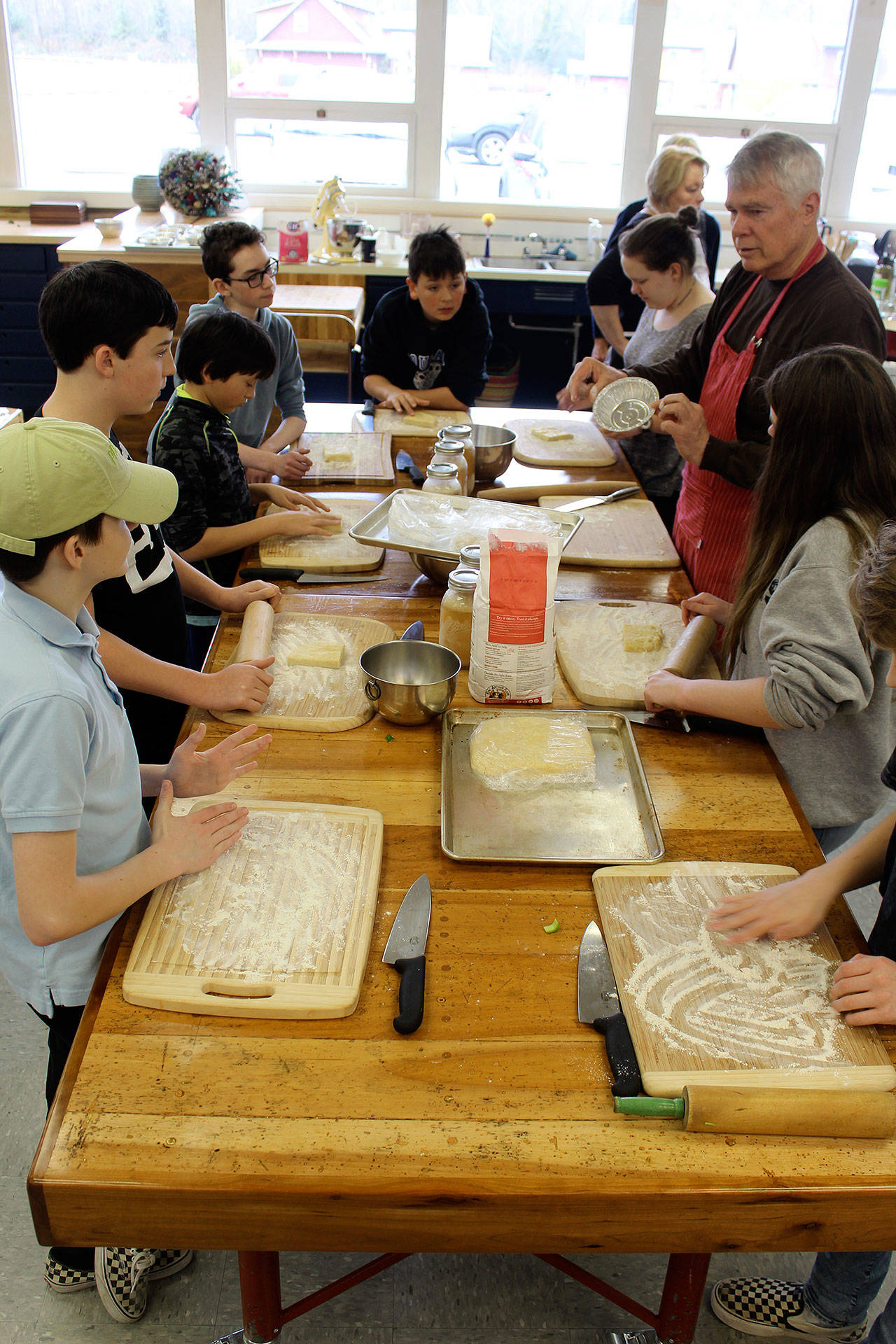 Joe Whisenand leads a lesson in how pie dough is made, including how to rest it, roll it and cut it. (Photo by Patricia Guthrie/Whidbey News Group)