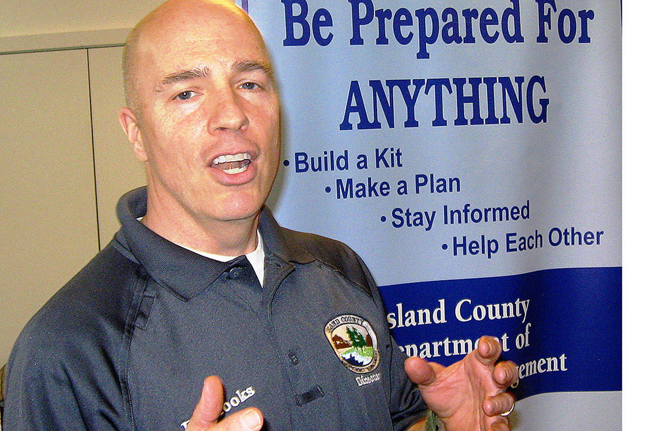 Island County Emergency Management Director Eric Brooks talks about the importance of disaster readiness Saturday at St. Hubert’s Church in Langley. Several agencies presented an informal demonstration and discussion of how to be ready for emergencies. (David Felice photo)