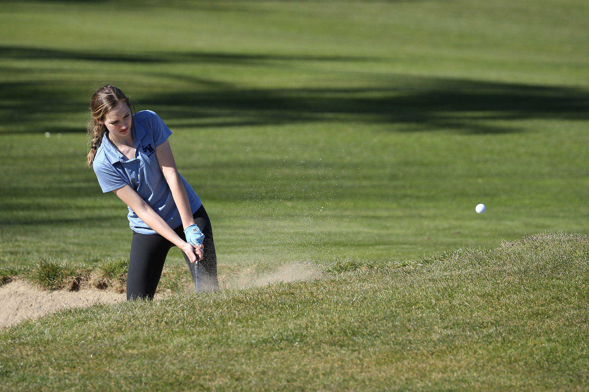 South Whidbeys Alyssa Ludtke blasts out of trouble at the Whidbey Shootout Tuesday. (Photo by John Fisken)