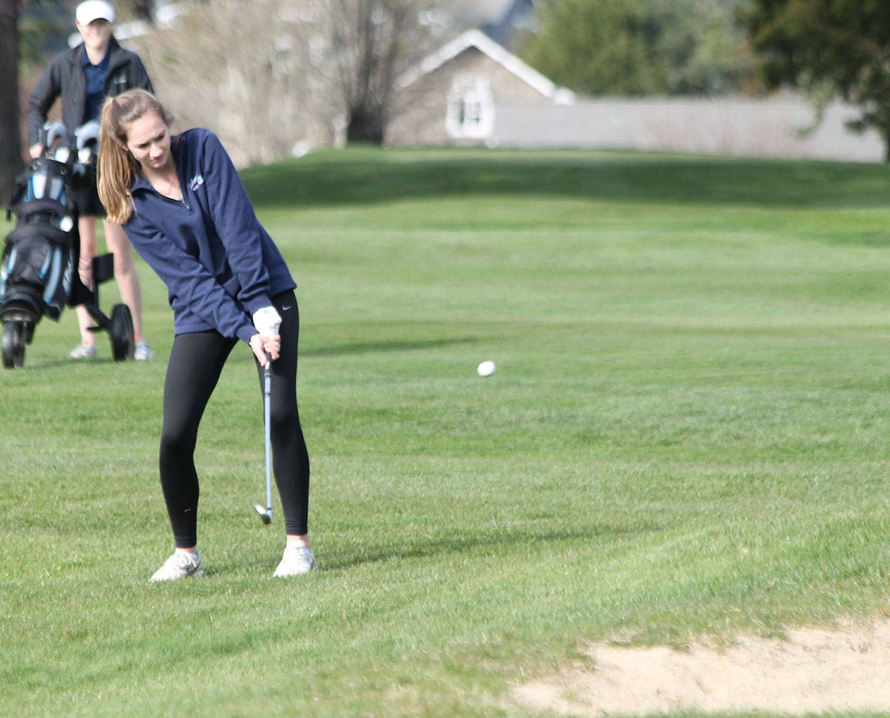 Alyssa Ludtke taps the ball to the green in South Whidbey match with Sultan Thursday.(Photo by Jim Waller/South Whidbey Record)