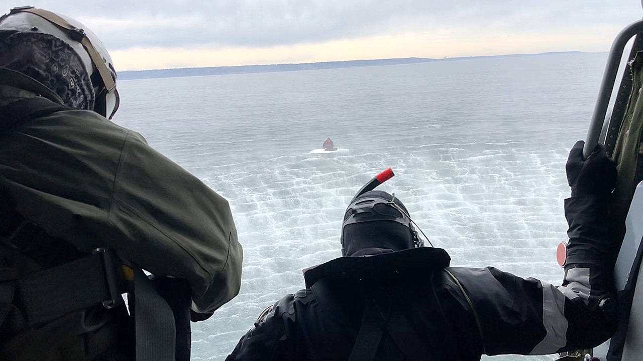 Navy photo                                A search and rescue team from Naval Air Station Whidbey Island save a boater off Possession Point.
