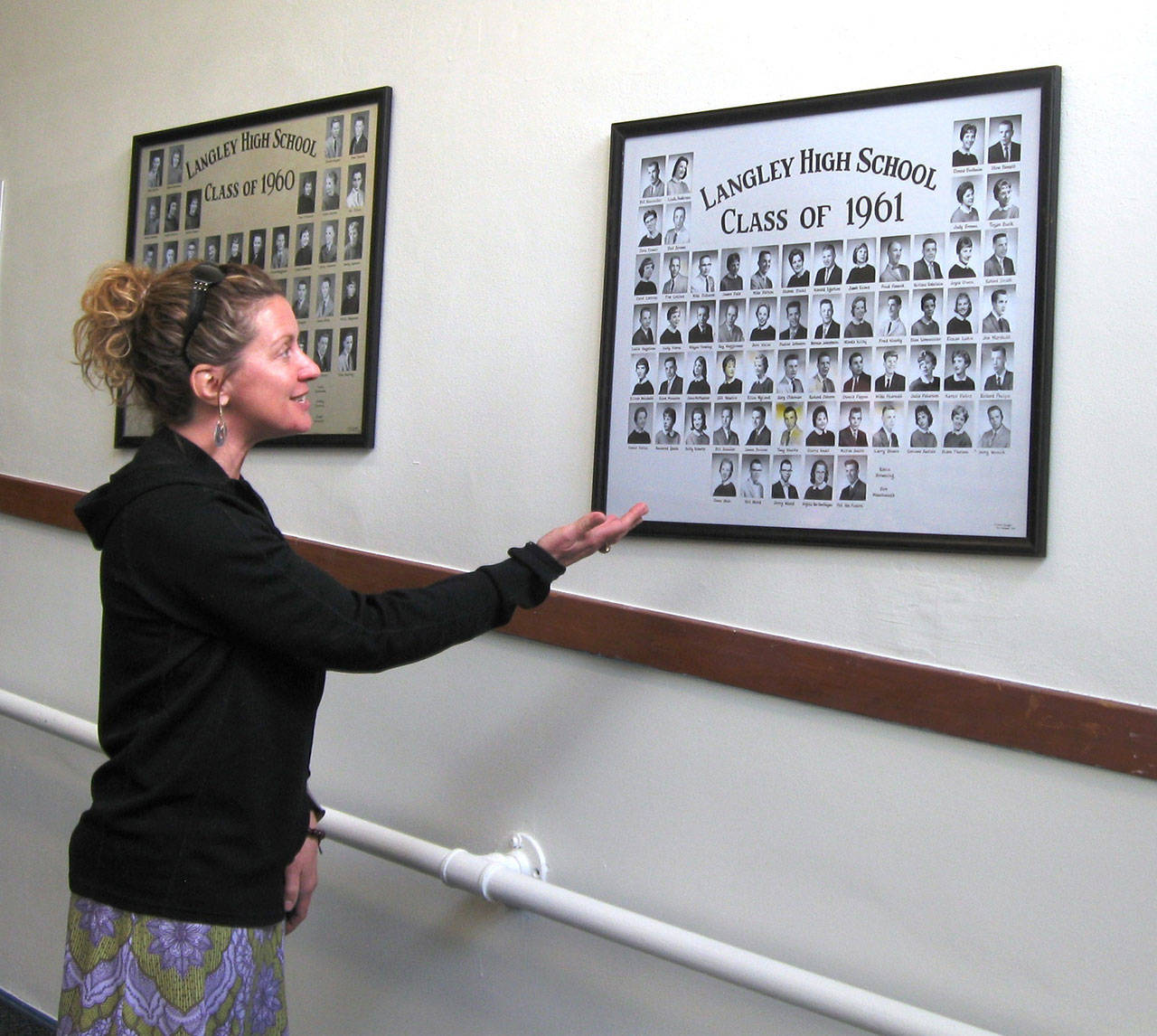 (Photo by Dave Felice)                                Langley Community Center Artistic Coordinator Jesse Levesque demonstrates the recently digitized Langley High School Class of 1961.
