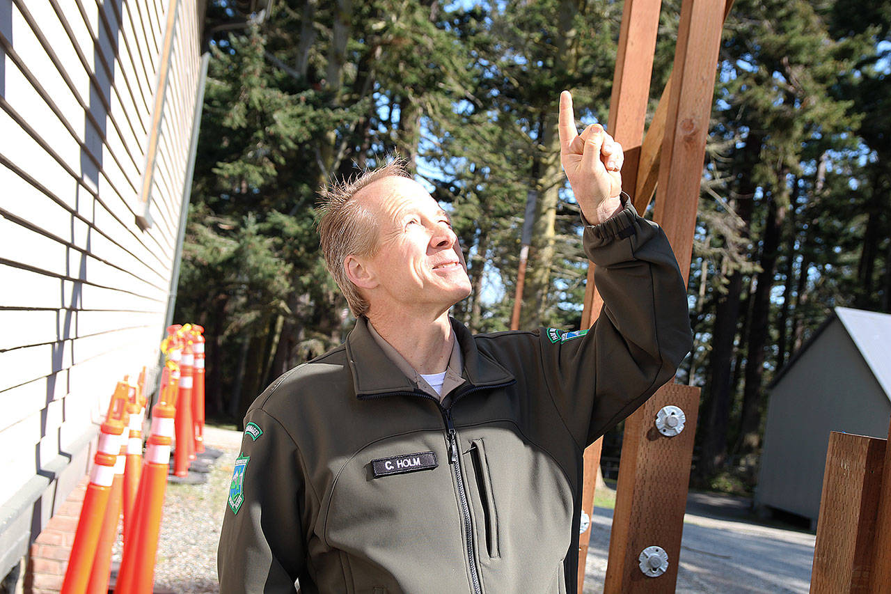 Chris Holm, Central Whidbey area manager for Washington State Parks, points out one of Fort Casey’s new bat boxes, which sit about 12 feet off the ground. The boxes were put in as an alternative for a maternity colony that had been roosting in the park office’s attic. Photo by Laura Guido/Whidbey News Group