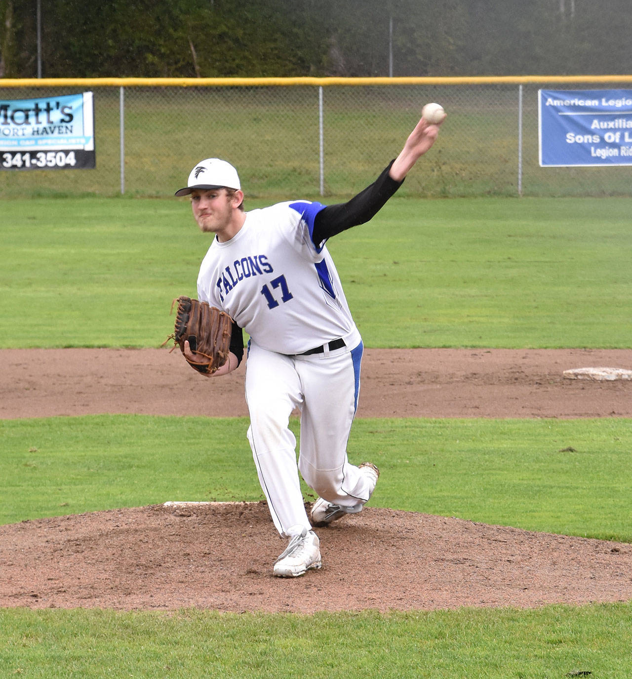 South Whidbey’s Brent Batchelor fires a pitch on the way to earning the win over Coupeville Wednesday. (Photo by Karen Carlson)
