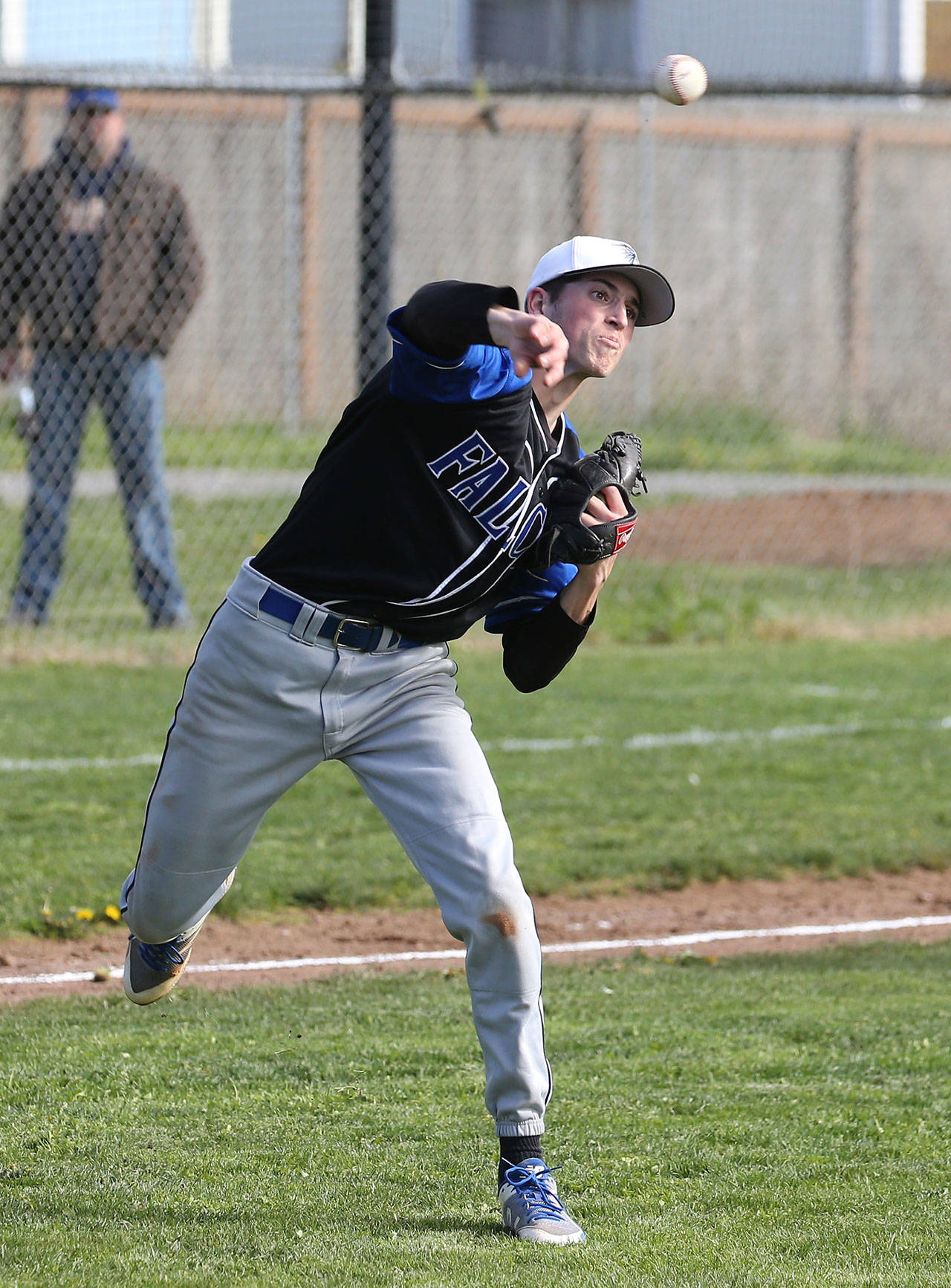 Pitcher Jon Bartel fields a ball in front of the mound and throws to first. (Photo by John Fisken)