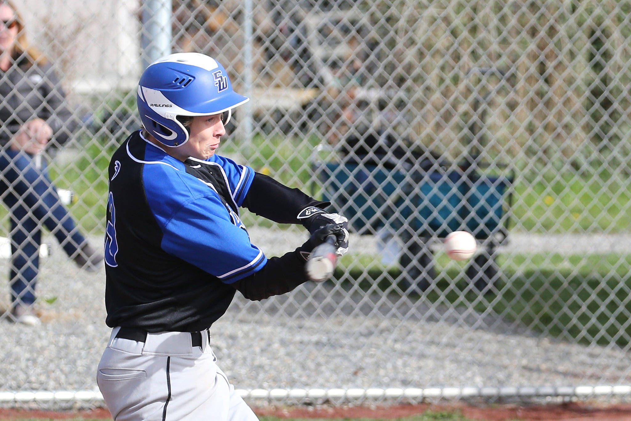 Drew Fry attacks a pitch in Friday’s game at Coupeville (Photo by John Fisken)