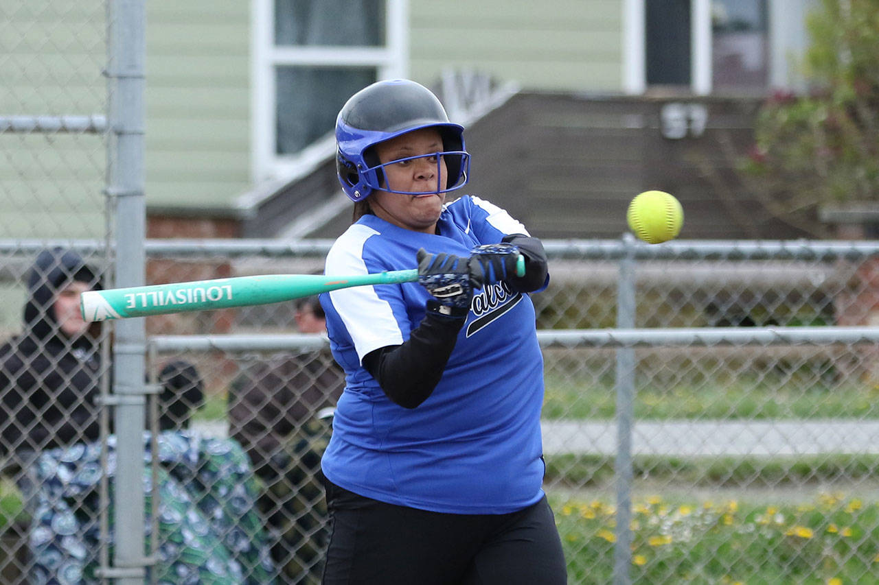 Arianna Briggs slaps a single for the Falcons in Tuesday’s game with Coupeville. (Photo by John Fisken)