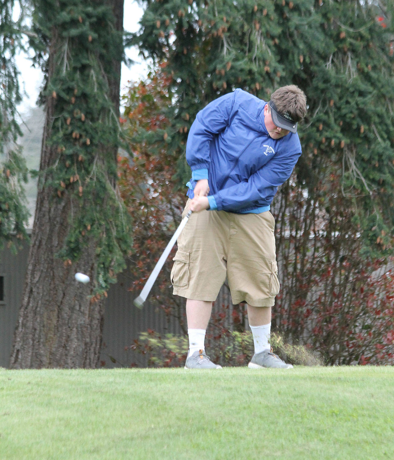Lewis Mattson drives from the first tee.(Photo by Jim Waller/South Whidbey Record)