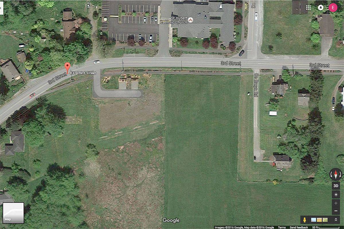 An L-shaped driveway with two parking areas (lower left) has already been developed on Third Street in Langley. Habitat for Humanity of Island County purchased the property more than two years ago with the goal to build a multi-family housing project. (Image courtesy of Google Maps)