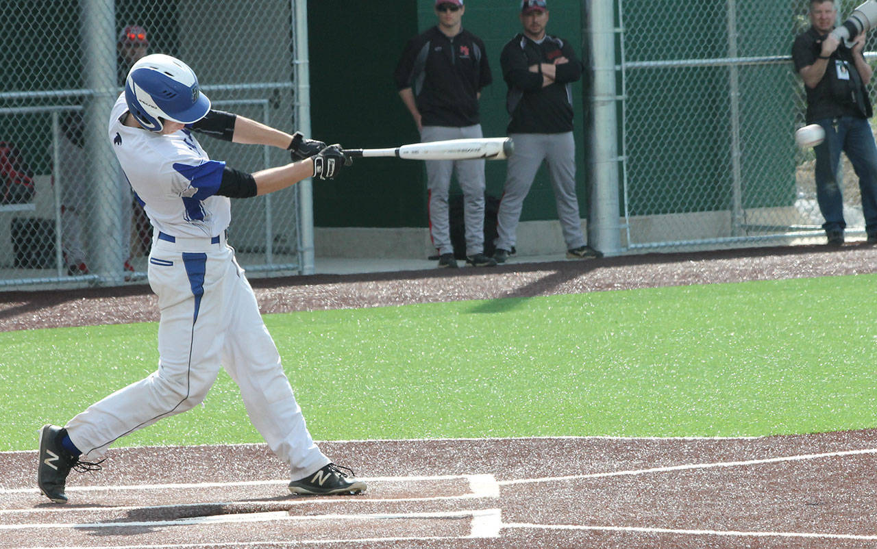 Ethan Petty lines a base hit for the Falcons.(Photo by Jim Waller/South Whidbey Record)