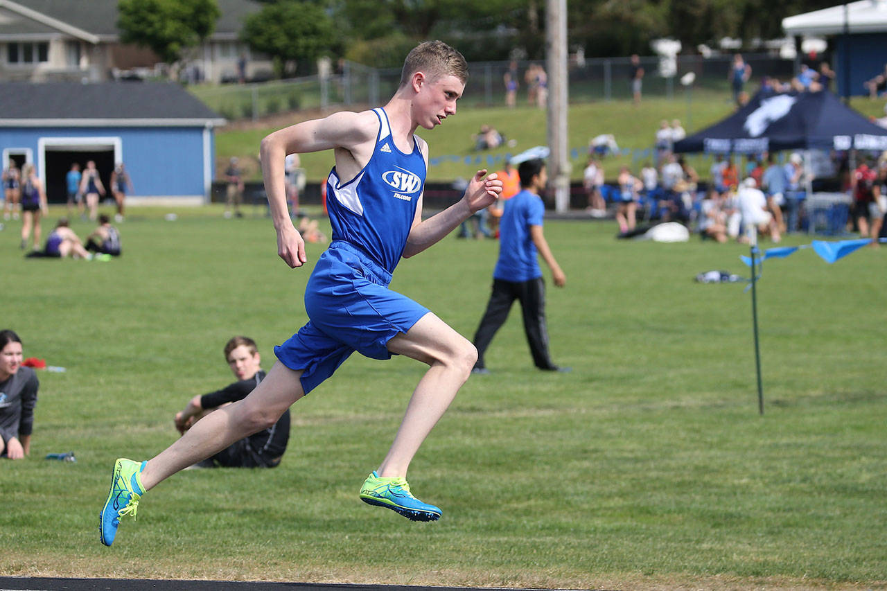 Ben Fly-Rinker runs the 200 meters for South Whidbey.(Photo by John Fisken)