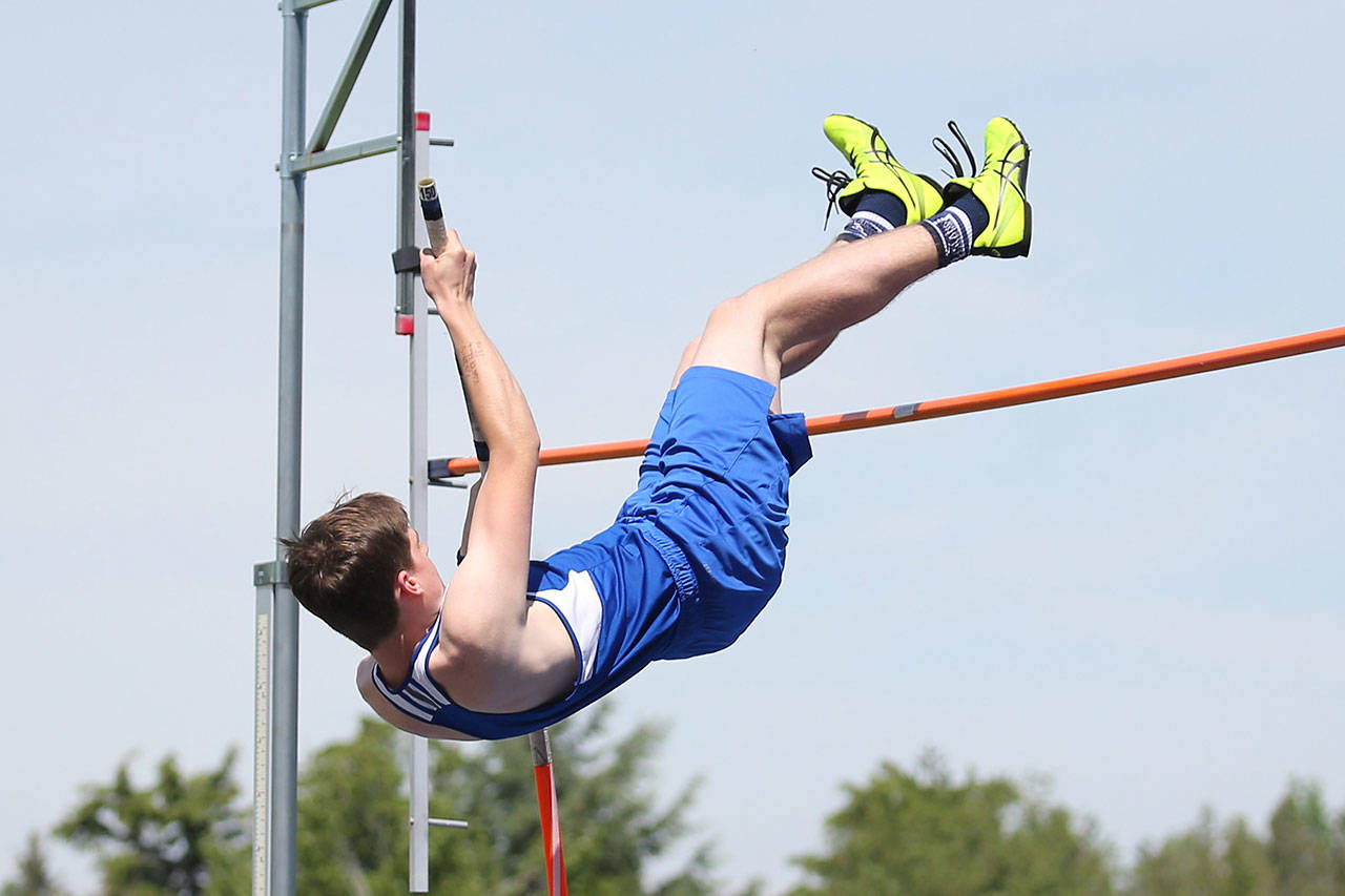 Tyler King leaps in the pole vault for the Falcons.(Photo by John Fisken)