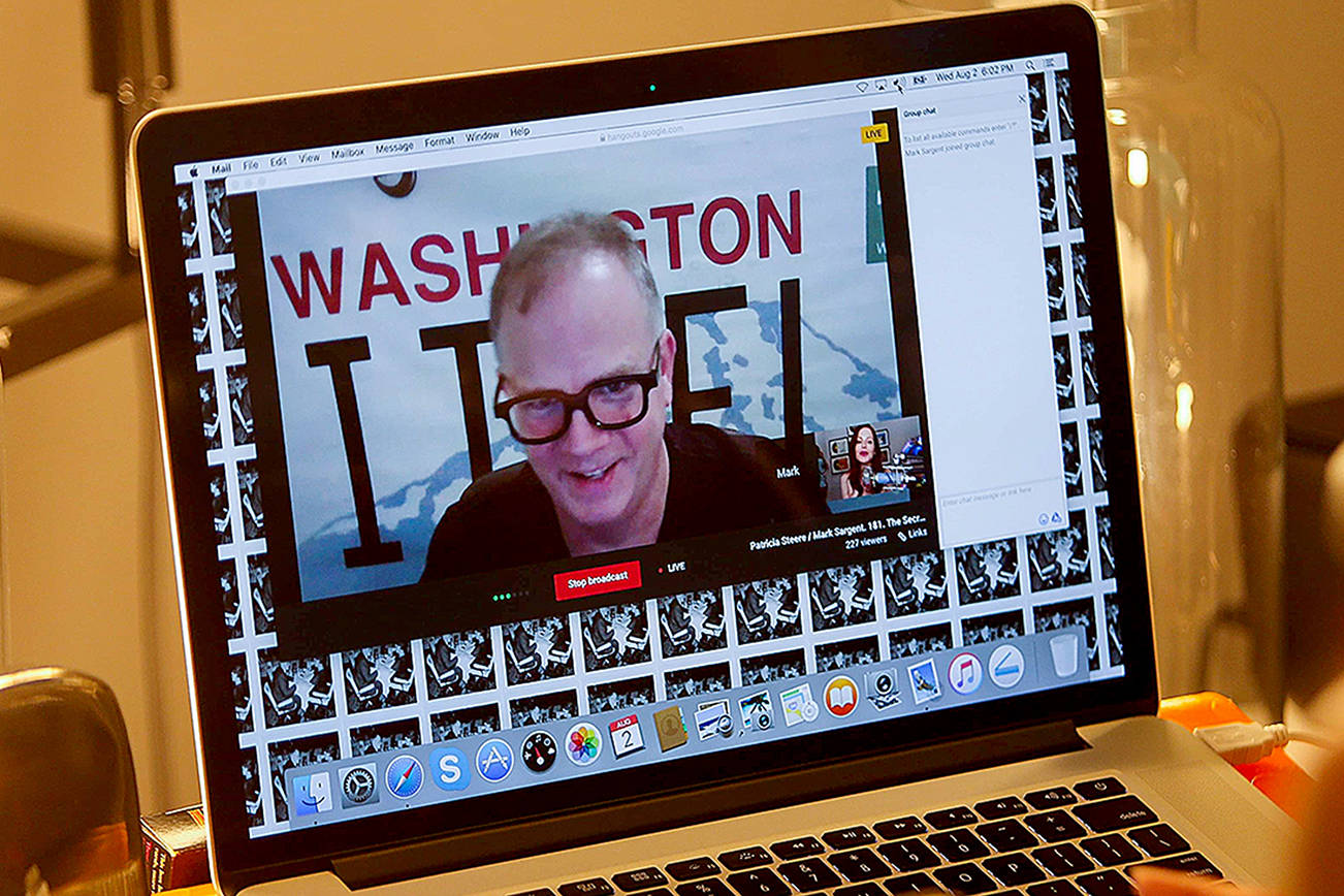 Mark Sargent of Whidbey Island is on the screen with Texas YouTuber Patricia Steere as she broadcasts “The Flat Earth and Other Hot Potatoes” from her Houston home. The two also share cameo roles (and some sexual tension) in the documentary “Behind the Curve” which was picked up by Netflix. (Mark Mulligan / Houston Chronicle)