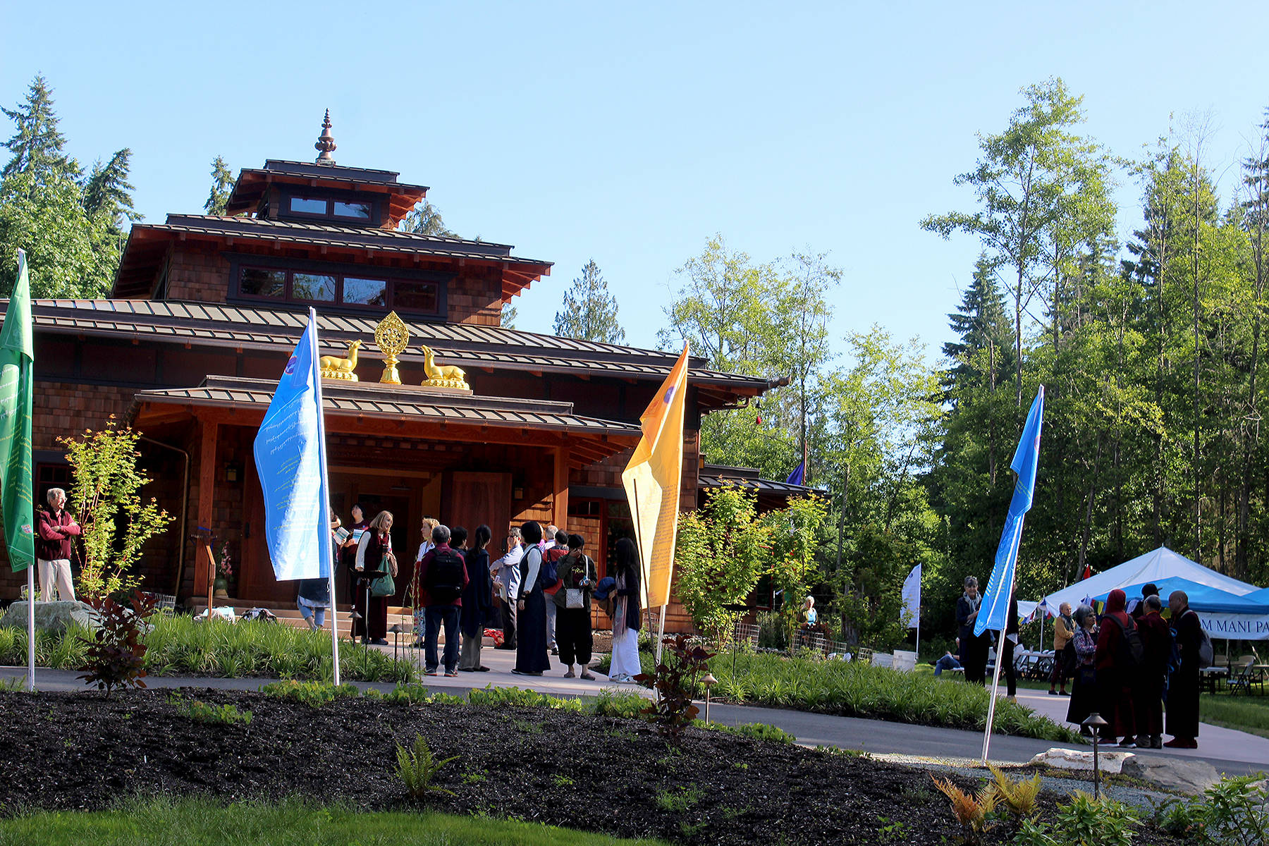 The new Buddhist Temple located in South Whidbey combines Northwest architecture with traditional Tibetan design. A multi-day gathering consecrated the building with monks who traveled from Asia for the ceremonies. Photo by Patricia Guthrie/Whidbey News Group