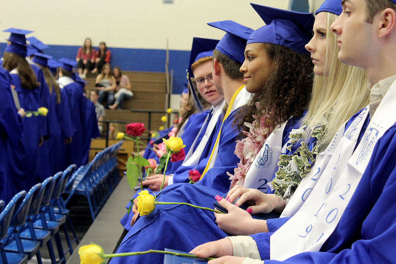 Red and yellow roses accompanied the awarding of diplomas to the Class of 2019 at Saturdays South Whidbey High School commencement. Photo by Patricia Guthrie/Whidbey News Group