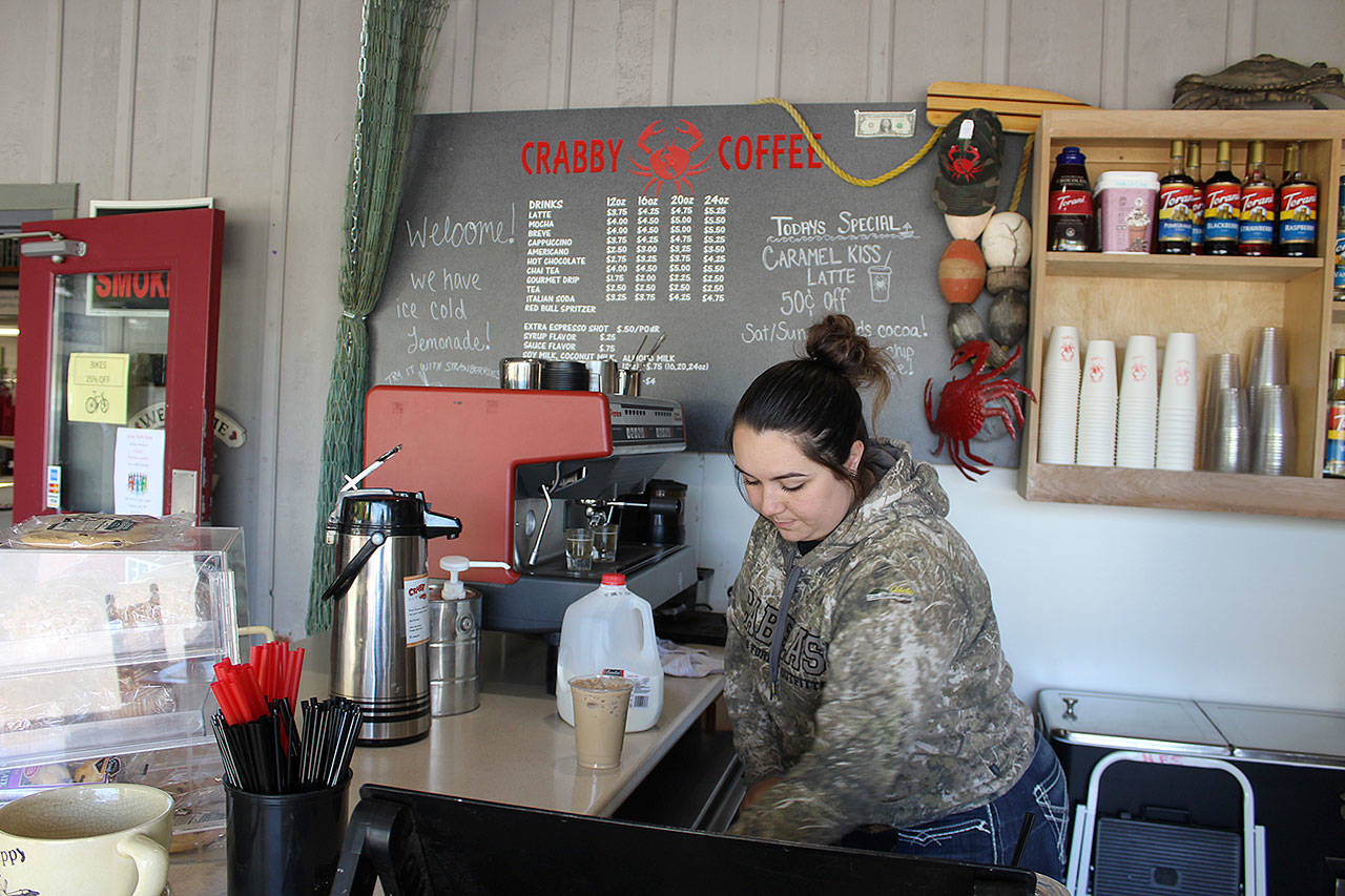 Barista Maddy Triplett prepares a drink at Crabby Coffee, which opened its second location two weeks ago in front of Island Senior Resources Thrift Store. Photo by Patricia Guthrie/Whidbey News Group