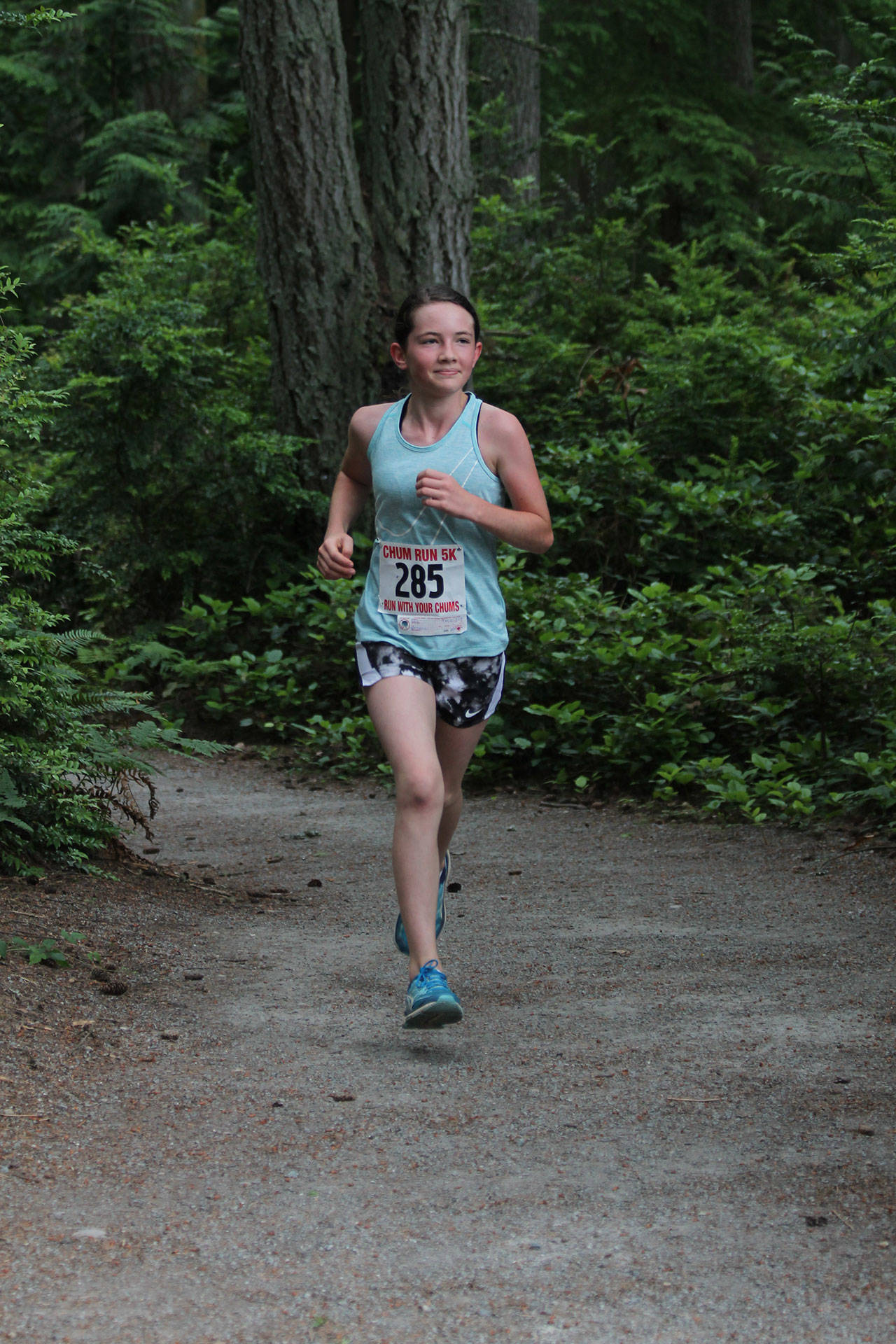 Cayle Key works her way through the wooded trail.(Photo by Jim Waller/South Whidbey Record)