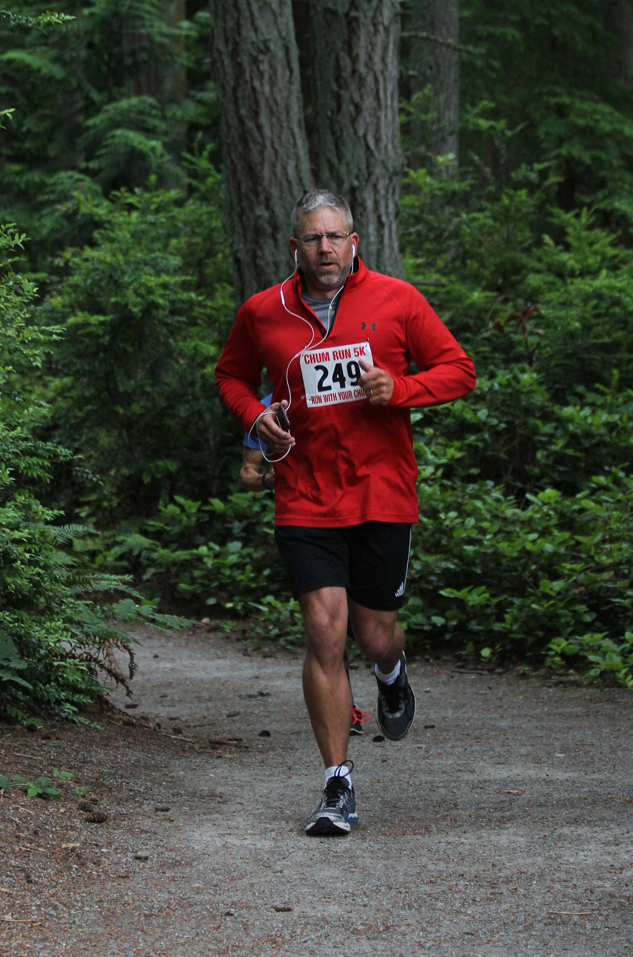 Don Lane emerges from the wooded portion of the run.(Photo by Jim Waller/South Whidbey Record)