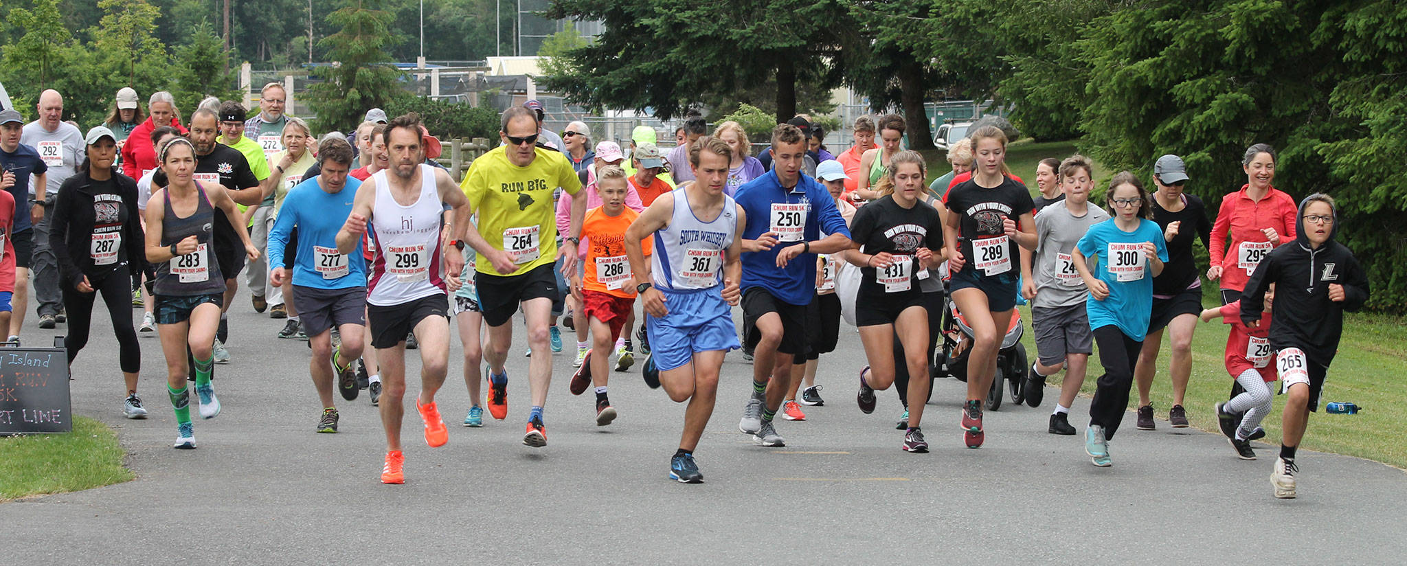 Runners take off from the start line in Saturday’s 22nd annual Chum Run.(Photo by Jim Waller/South Whidbey Record)