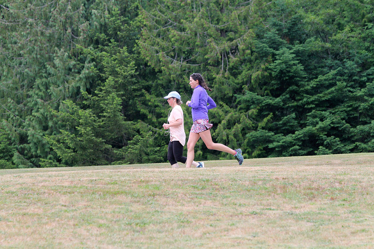 A duo slips along the down-hill portion of the race.(Photo by Jim Waller/South Whidbey Record)